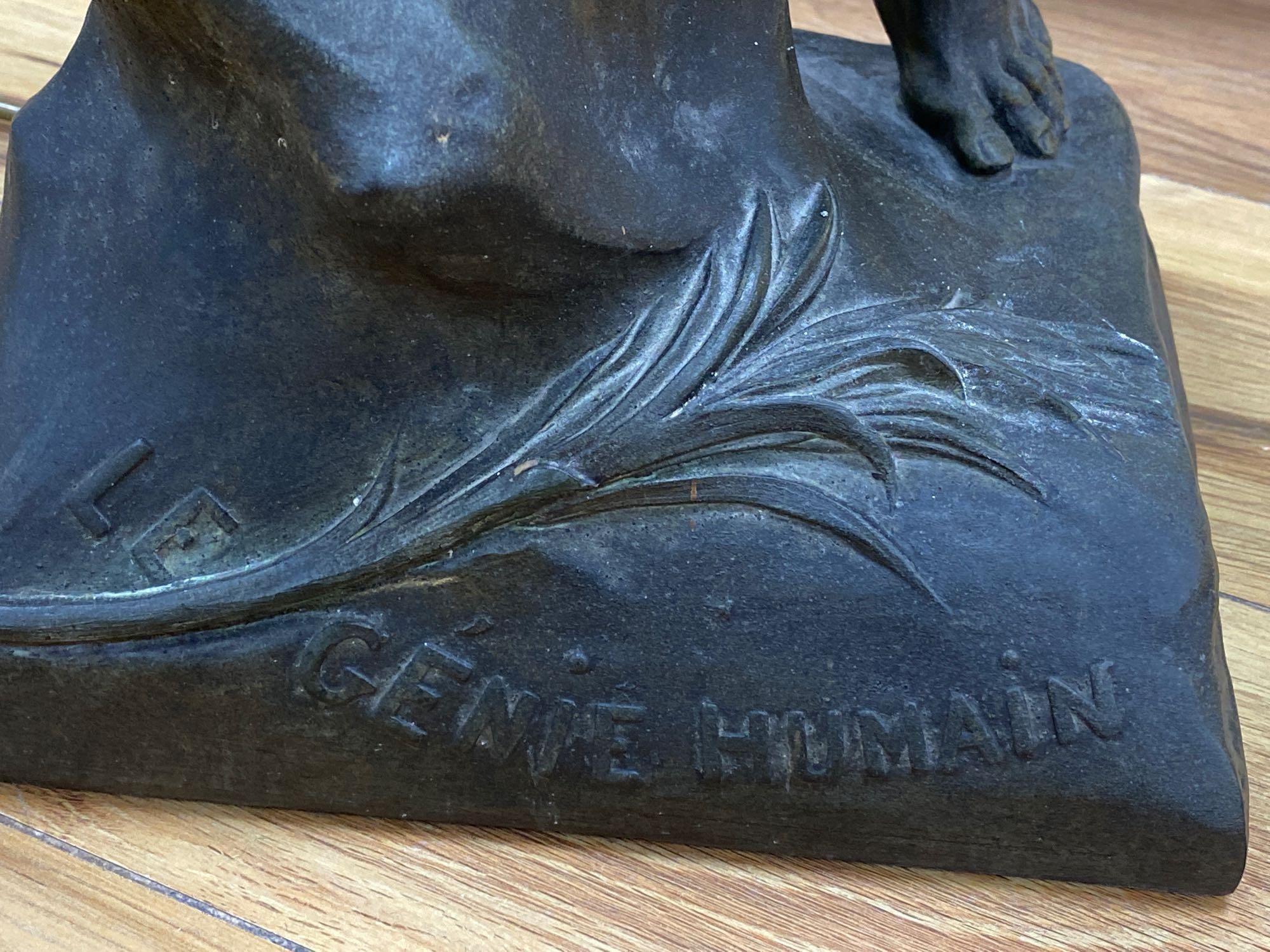 A bronzed finished lamp stem, Le Genie Humain, on rouge marble base, 90cm